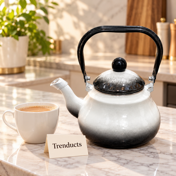 Enamel Coated Kettle pouring tea on an elegant kitchen table | Trenducts
