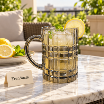Juice mug filled with lemonade and ice on a table | Trenducts