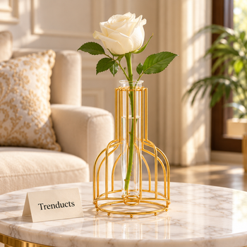 Golden flower vase with a white rose on a side table | Trenducts