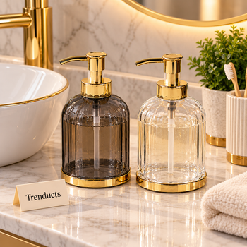 Soap dispenser with gold pump on a bathroom sink | Trenducts
