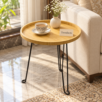 Round foldable side table beside a sofa - Trenducts