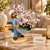 Man Figurine Flower Planter with Artificial White Blossoms