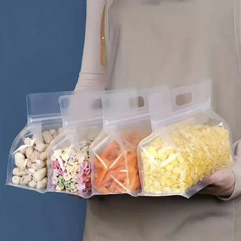 4-piece set of reusable jar-shaped leakproof food storage bags in small and medium sizes.
