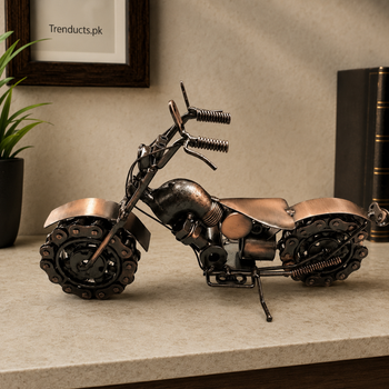 Ten-inch chain-wheel metal bike showpiece on a stone shelf