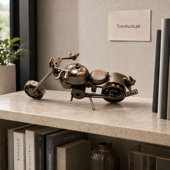 Compact six-inch metal bike showpiece on a modern bookshelf