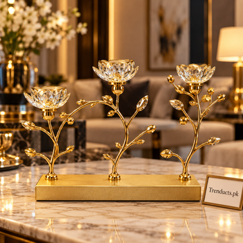 Multi-arm gold lotus candle stand styled in a luxury interior