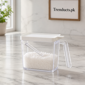 Seasoning acrylic jar with white lid, clear handle and spoon on a kitchen counter