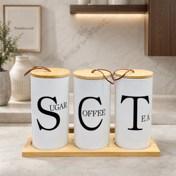 Three white ceramic jars labelled Sugar Coffee and Tea