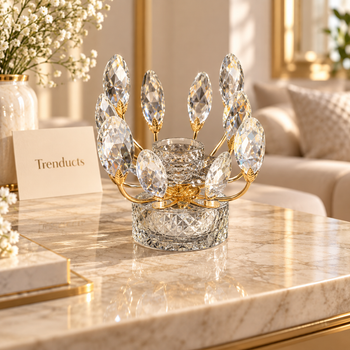 Crystal leaf candle stand with round crystal base on marble table