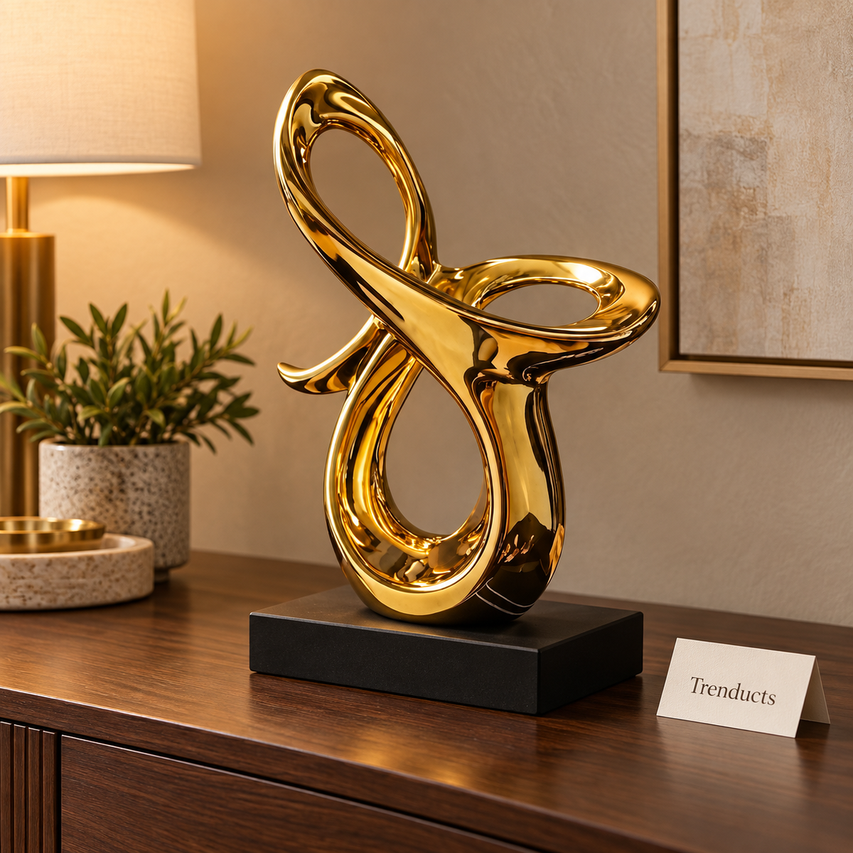 Gold Abstract Loop Sculpture with Black Base