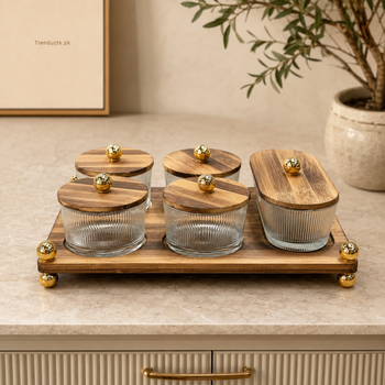 Five ribbed glass dry fruit containers on walnut-finish tray