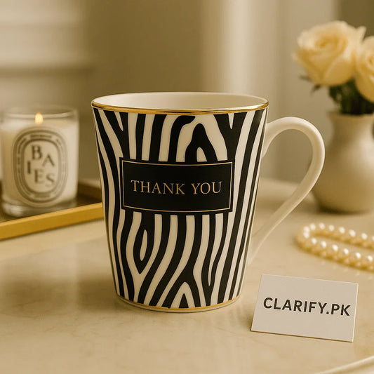 Zebra Elegance Ceramic Coffee Mug – Black & White with Gold Rim - Clarify.pk